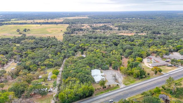 a view of a forest with an outdoor space