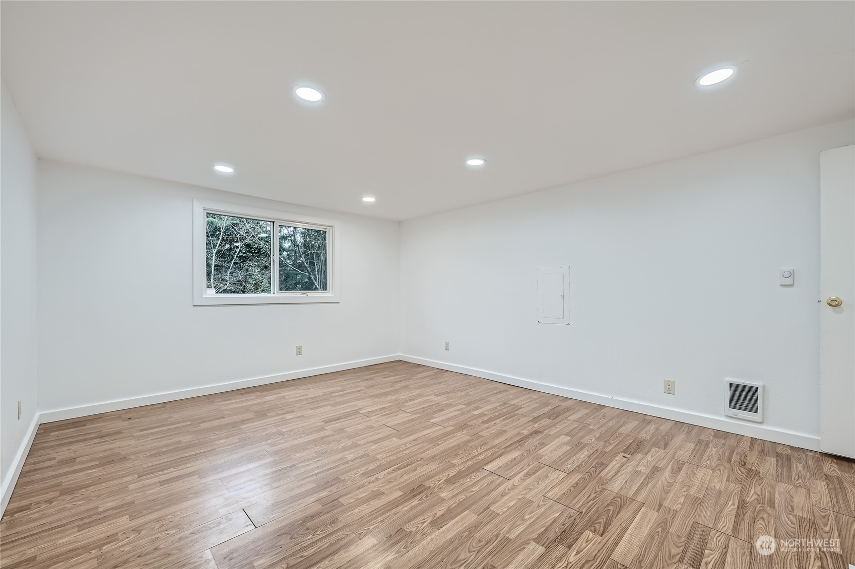 1332 192nd Street Southeast, Unit 17 Bothell, WA 98012 - Photo 14 of 24 an empty room with wooden floor and windows