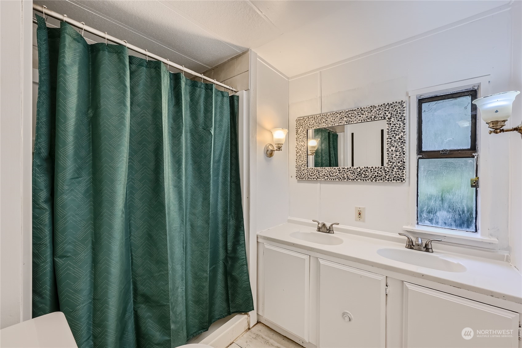 1332 192nd Street Southeast, Unit 17 Bothell, WA 98012 - Photo 16 of 24 a bathroom with a sink and a mirror