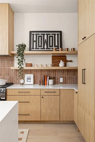 a kitchen with a refrigerator and cabinets