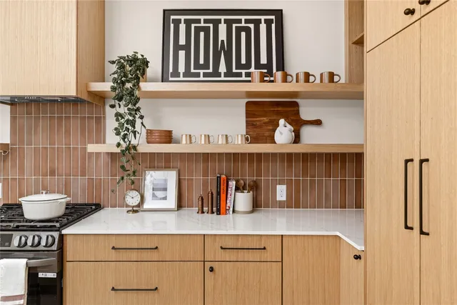 a kitchen with a sink and cabinets