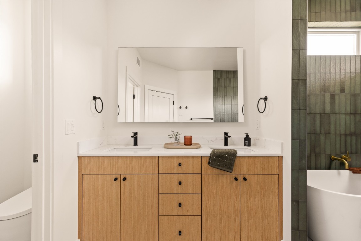 4530 Clawson Road, Unit 1 Austin, TX 78745 - Photo 20 of 24 Full bath with a soaking tub and double vanity