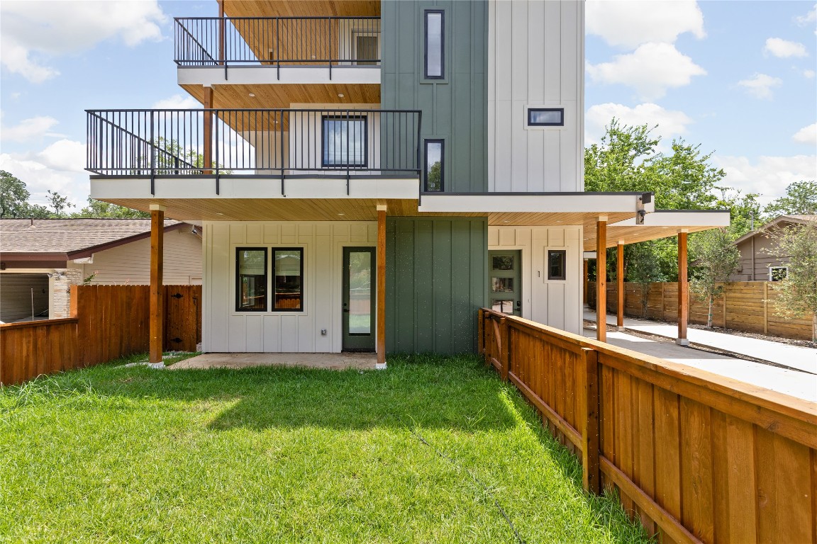 4530 Clawson Road, Unit 1 Austin, TX 78745 - Photo 3 of 24 Rear view of property featuring board and batten siding, a patio, a balcony, and a fenced backyard