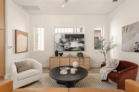 a living room with furniture and a large window