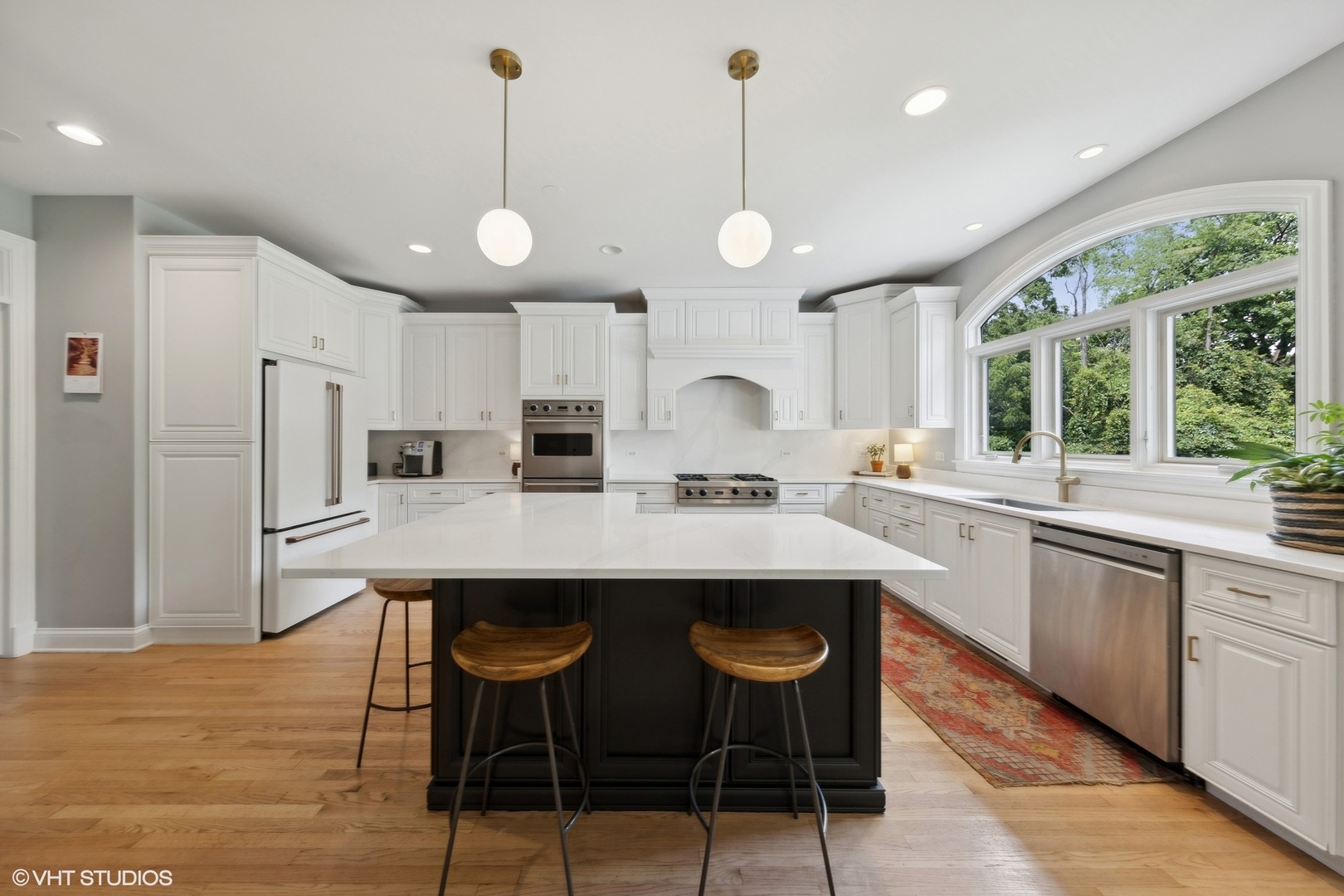 N491 Peter Road Winfield, IL 60190 - Photo 11 of 55 a kitchen with stainless steel appliances a dining table chairs stove refrigerator and cabinets