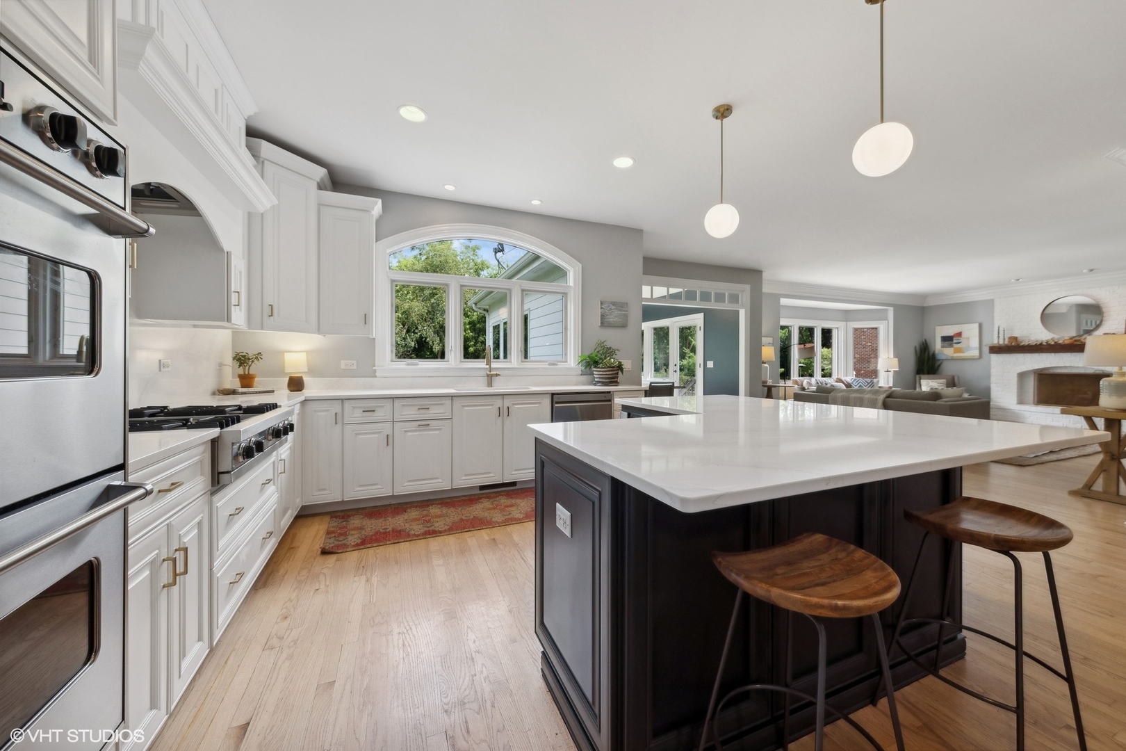 N491 Peter Road Winfield, IL 60190 - Photo 14 of 55 a kitchen with a stove a sink a dining table and chairs
