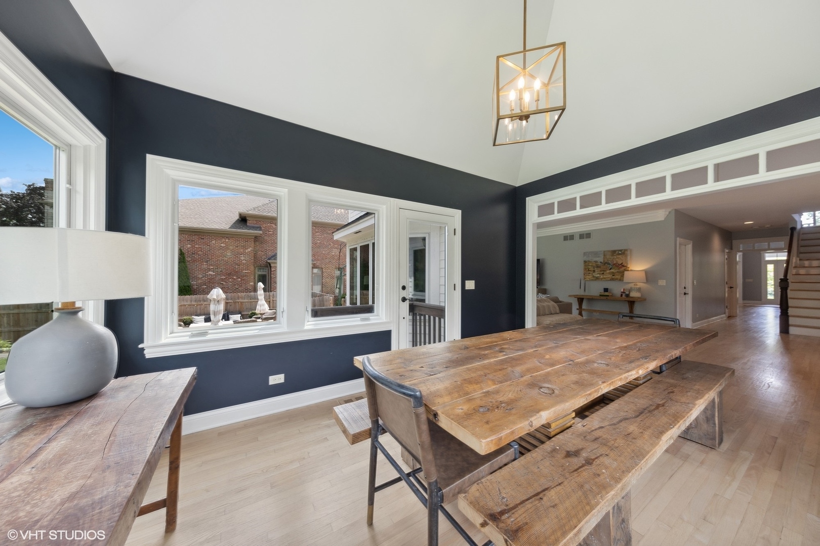 N491 Peter Road Winfield, IL 60190 - Photo 18 of 55 a living room with a table and paintings on the wall