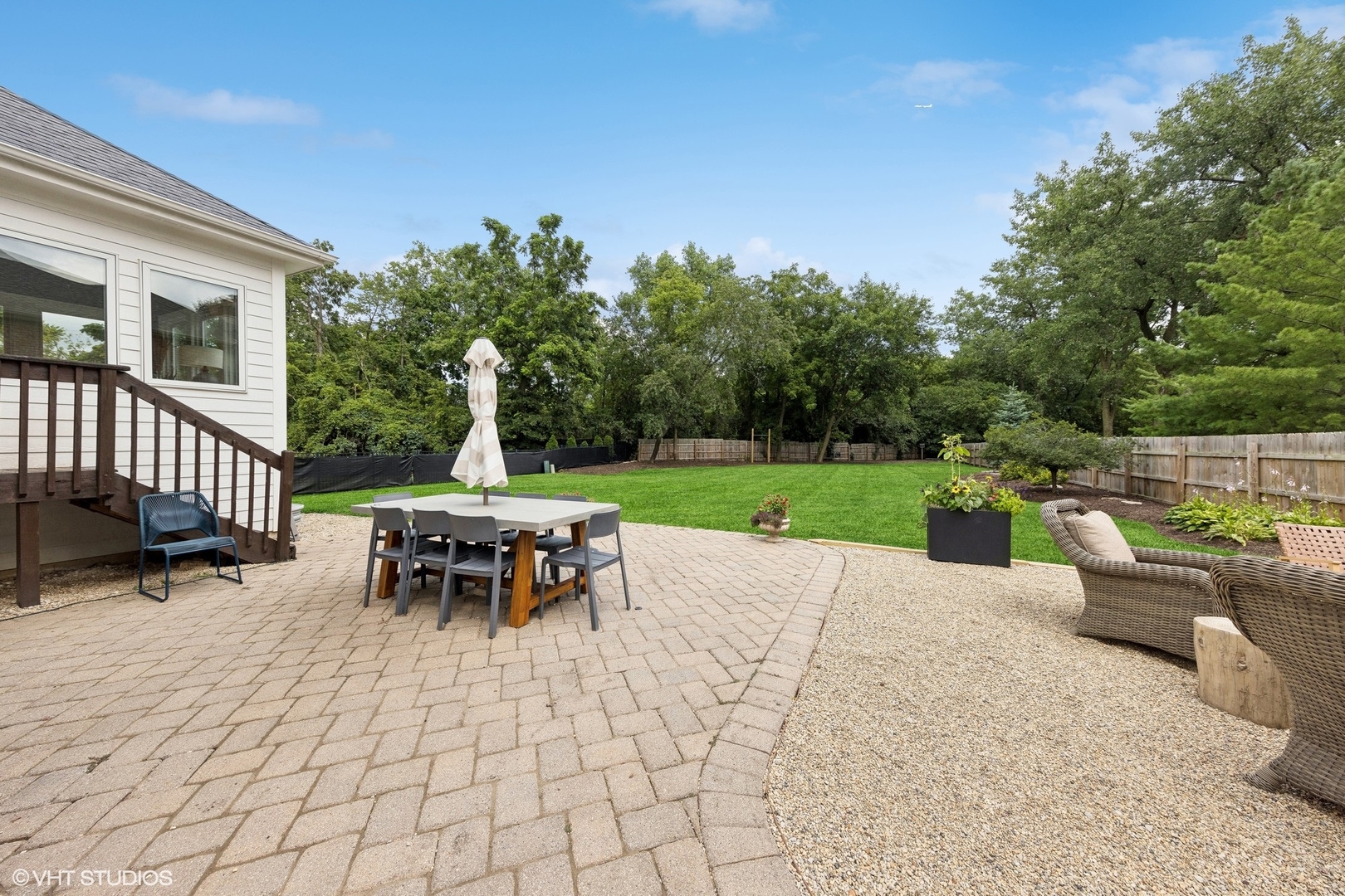 N491 Peter Road Winfield, IL 60190 - Photo 49 of 55 a view of a patio with a dining table and chairs with a fire pit