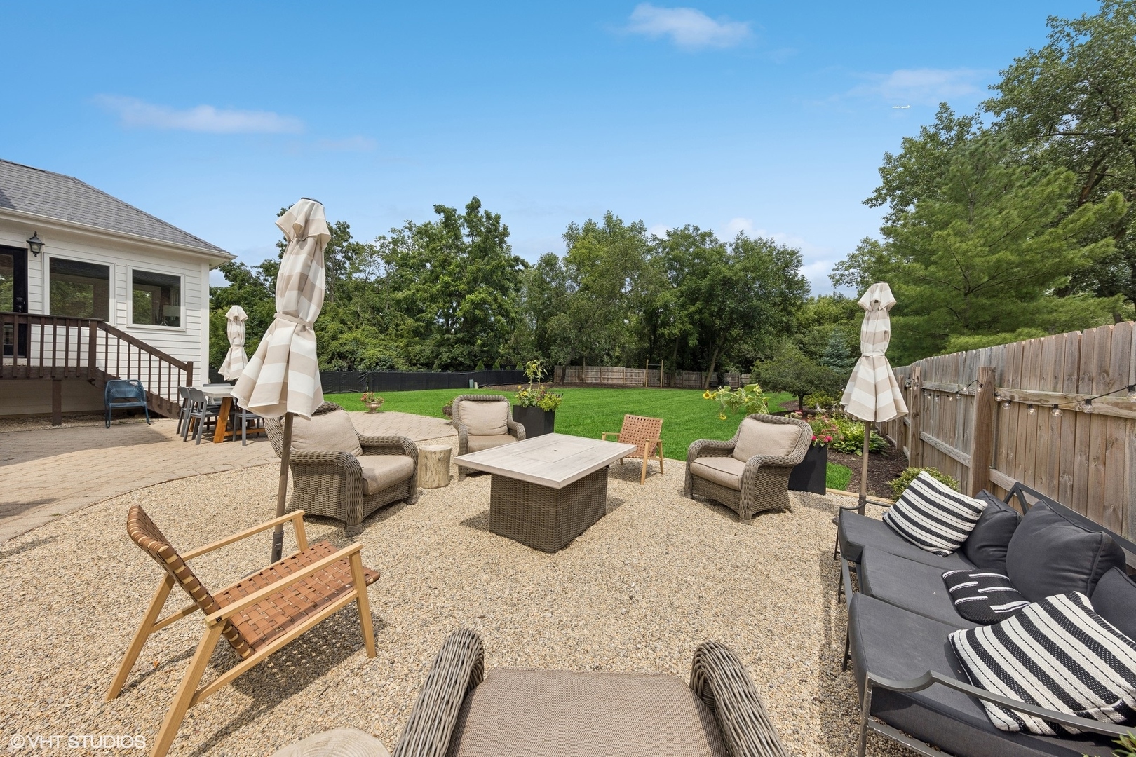 N491 Peter Road Winfield, IL 60190 - Photo 6 of 55 a view of a patio with couches chairs and a table and chairs with wooden fence