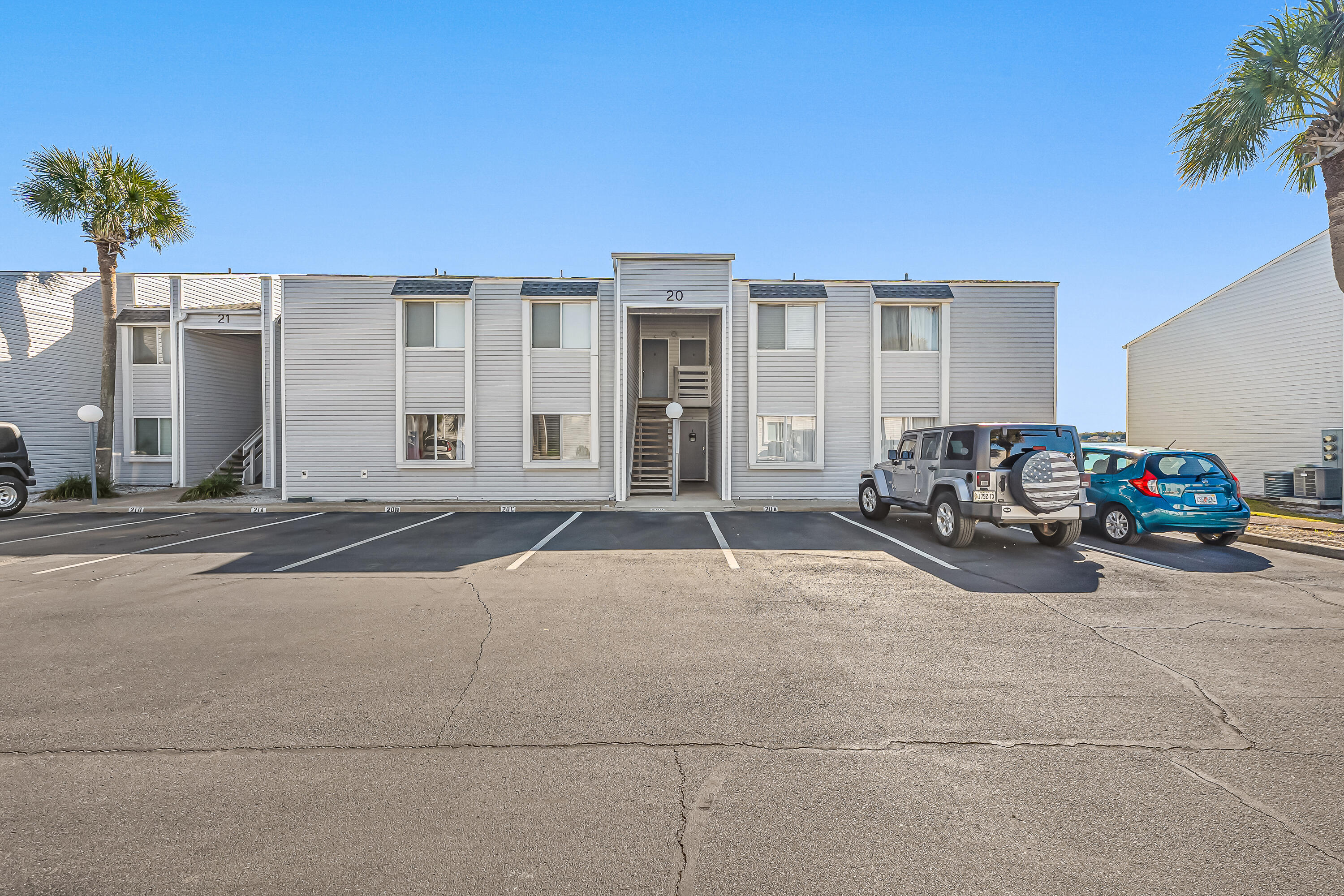 101 Old Ferry Road, Unit 20B Shalimar, FL 32579 - Photo 4 of 30 a couple of cars parked in front of a house