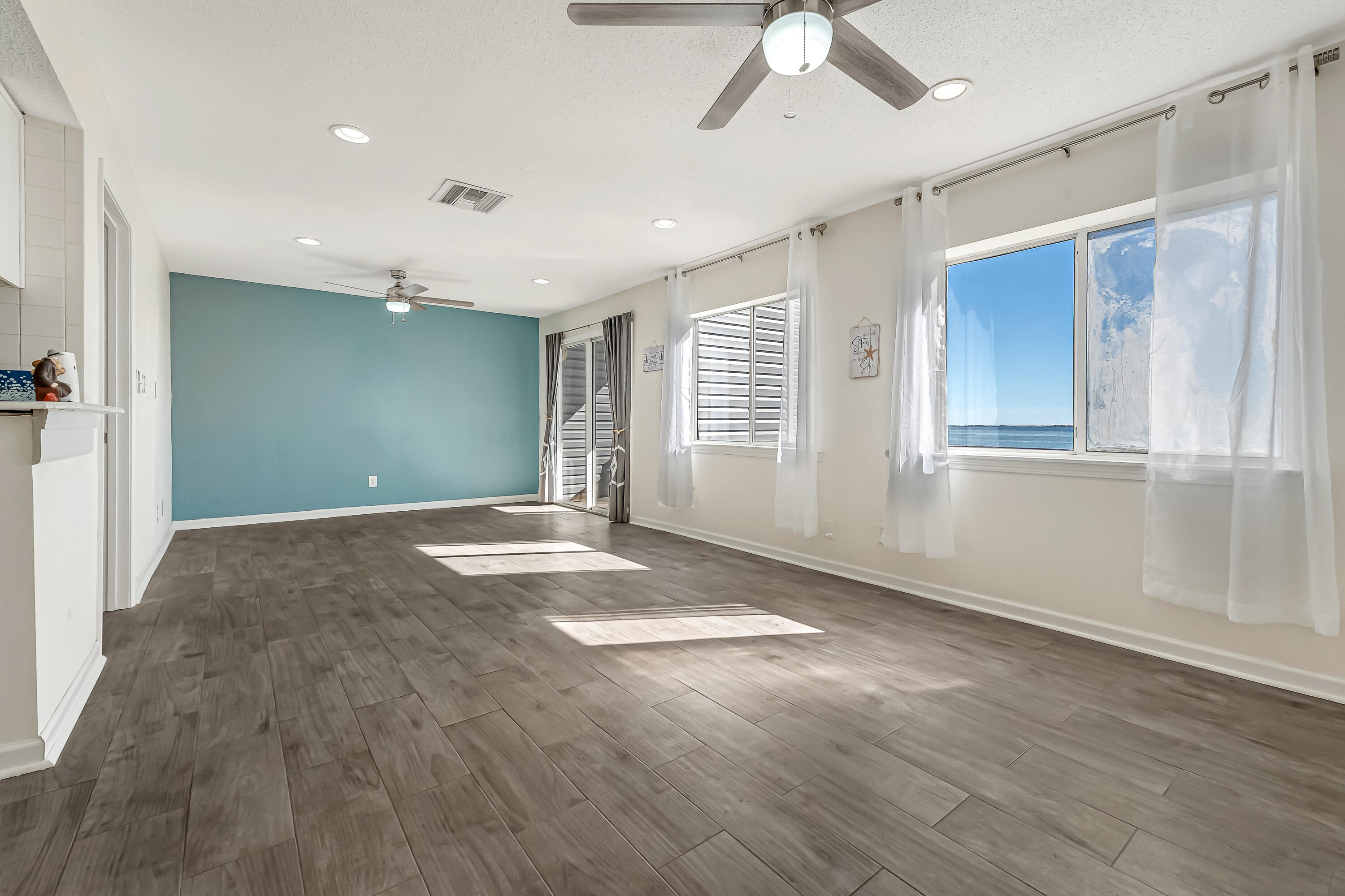 101 Old Ferry Road, Unit 20B Shalimar, FL 32579 - Photo 6 of 30 a view of livingroom with window and hardwood floor