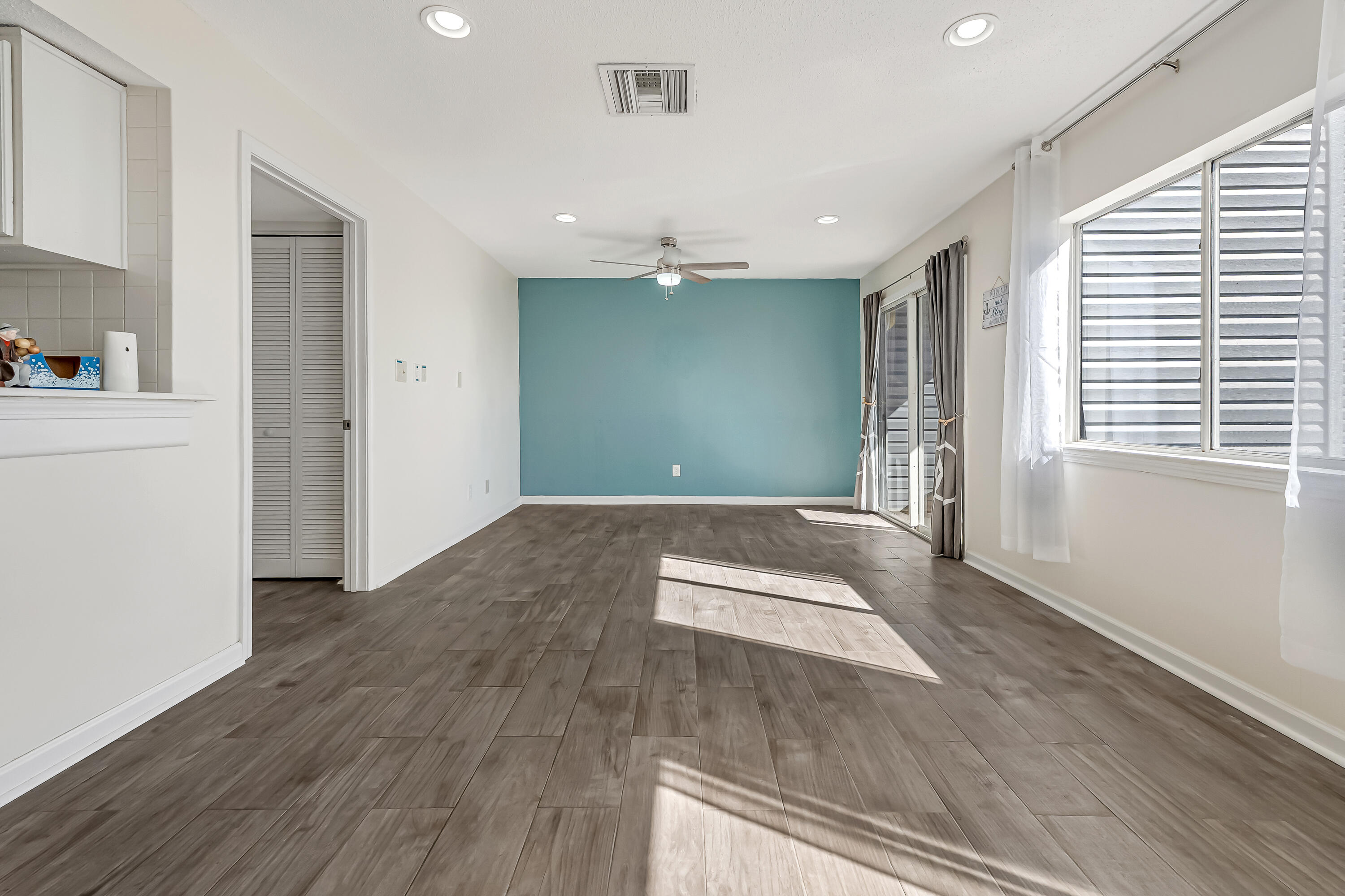 101 Old Ferry Road, Unit 20B Shalimar, FL 32579 - Photo 8 of 30 a view of empty room with wooden floor and fan