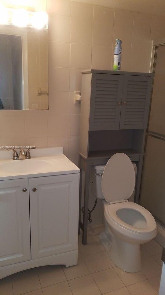 Mango Hill Hialeah, FL 33012 - Photo 14 of 18 a white toilet sitting next to a bathroom sink