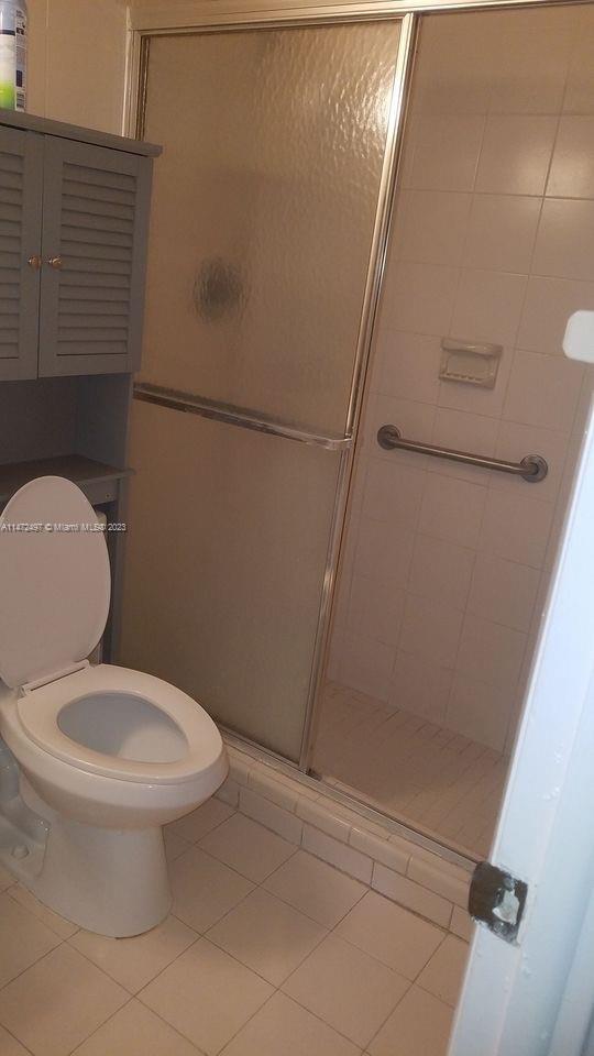 Mango Hill Hialeah, FL 33012 - Photo 15 of 18 a white toilet sitting next to a shower