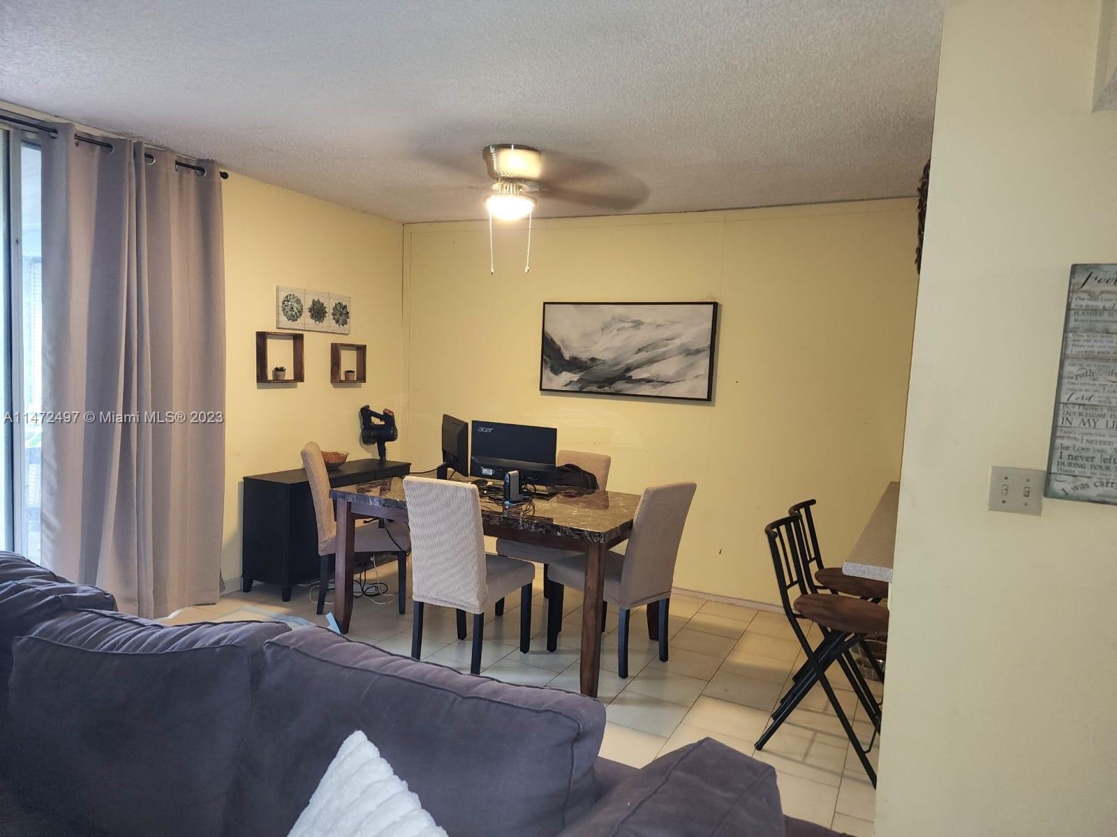 Mango Hill Hialeah, FL 33012 - Photo 3 of 18 a view of a livingroom with furniture and a window