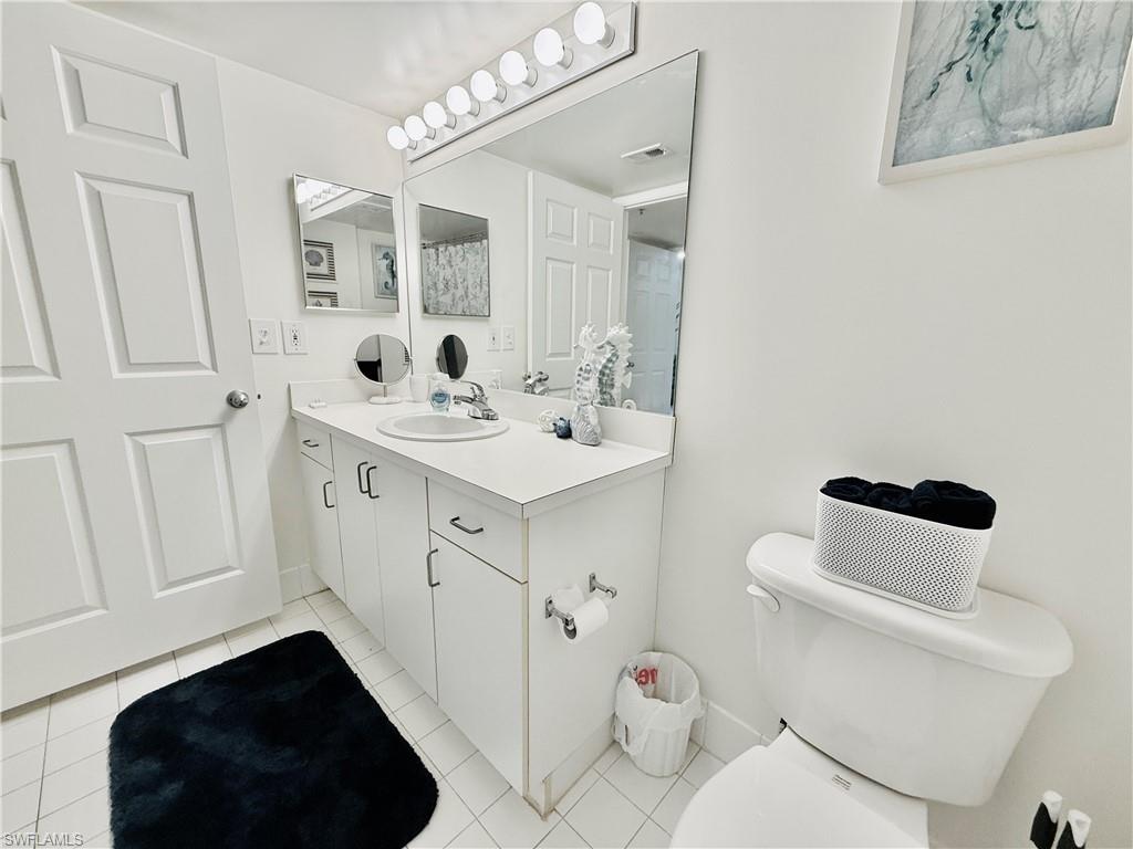 1820 Florida Club Circle, Unit 2210 Naples, FL 34112 - Photo 16 of 37 Bathroom with vanity and light tile patterned floors