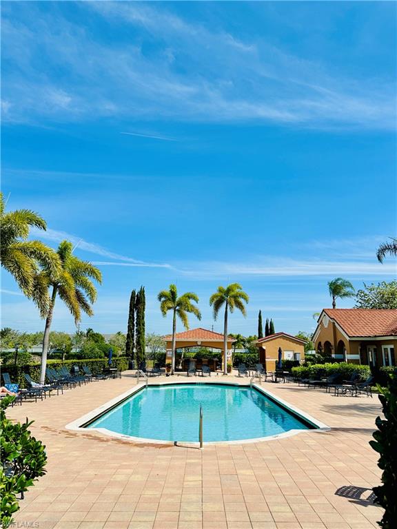 1820 Florida Club Circle, Unit 2210 Naples, FL 34112 - Photo 26 of 37 Community pool featuring a patio