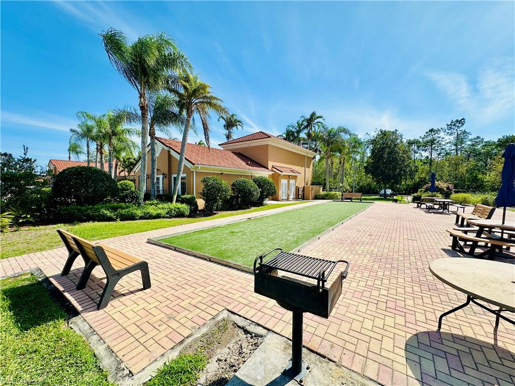 1820 Florida Club Circle, Unit 2210 Naples, FL 34112 - Photo 30 of 37 View of patio featuring a bocce ball area
