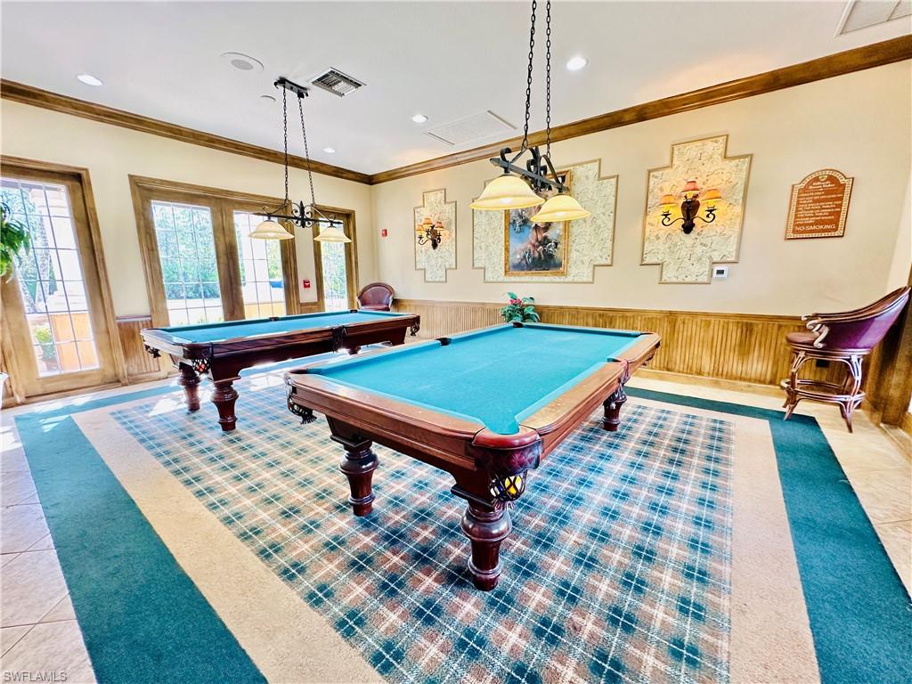 1820 Florida Club Circle, Unit 2210 Naples, FL 34112 - Photo 34 of 37 Recreation room with wainscoting, wooden walls, crown molding, and billiards