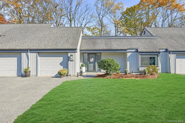 a view of a house with backyard porch and sitting area