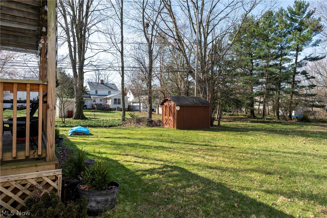 1170 Roland Road Lyndhurst, OH 44124 - Photo 32 of 36 View of yard featuring a storage unit