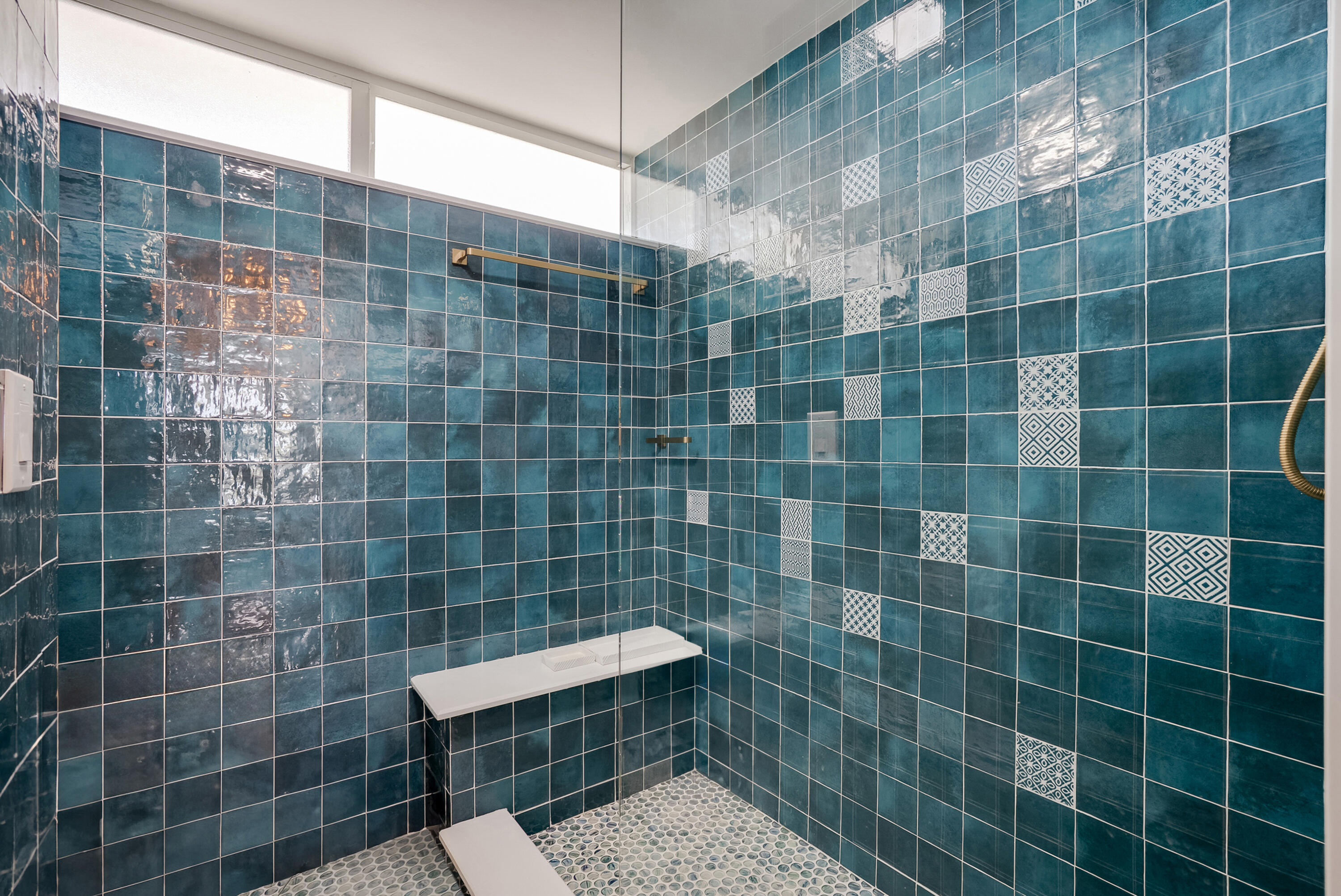 201 North Riverside Drive, Unit 402 Pompano Beach, FL 33062 - Photo 12 of 30 a bathroom with a sink a toilet a mirror and a shower