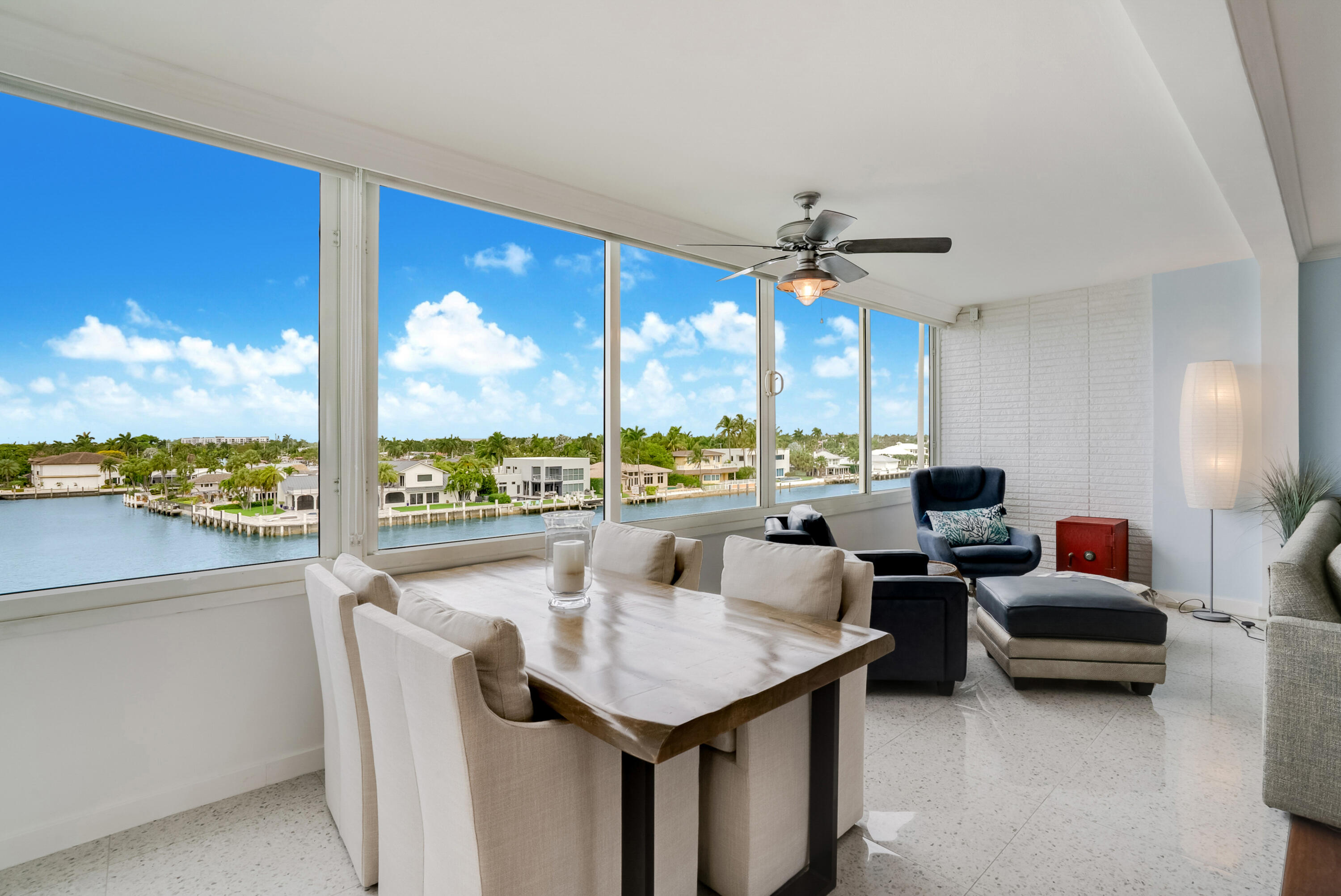 201 North Riverside Drive, Unit 402 Pompano Beach, FL 33062 - Photo 13 of 30 a living room with furniture and a large window