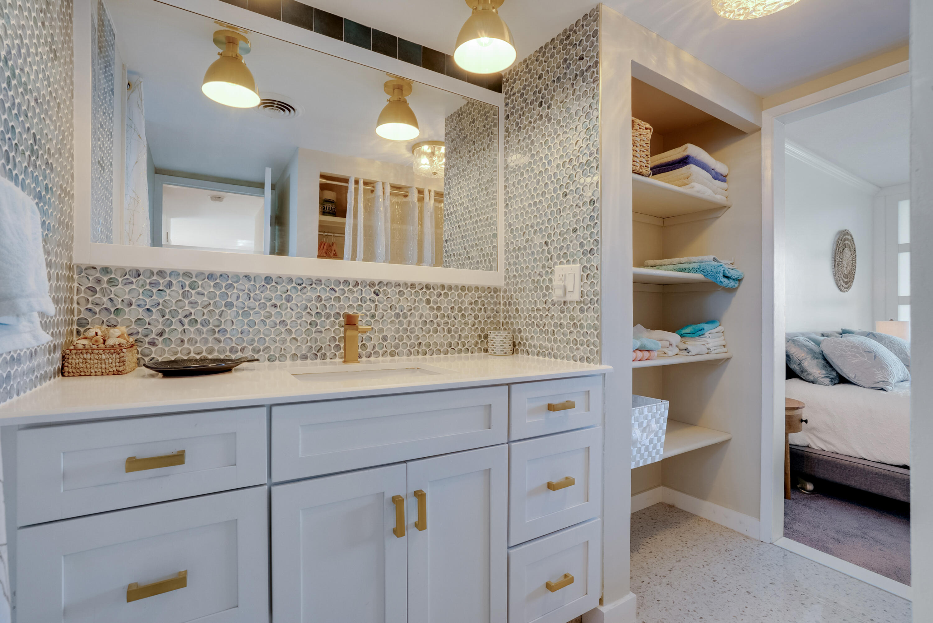 201 North Riverside Drive, Unit 402 Pompano Beach, FL 33062 - Photo 15 of 30 a bathroom with a sink and a mirror