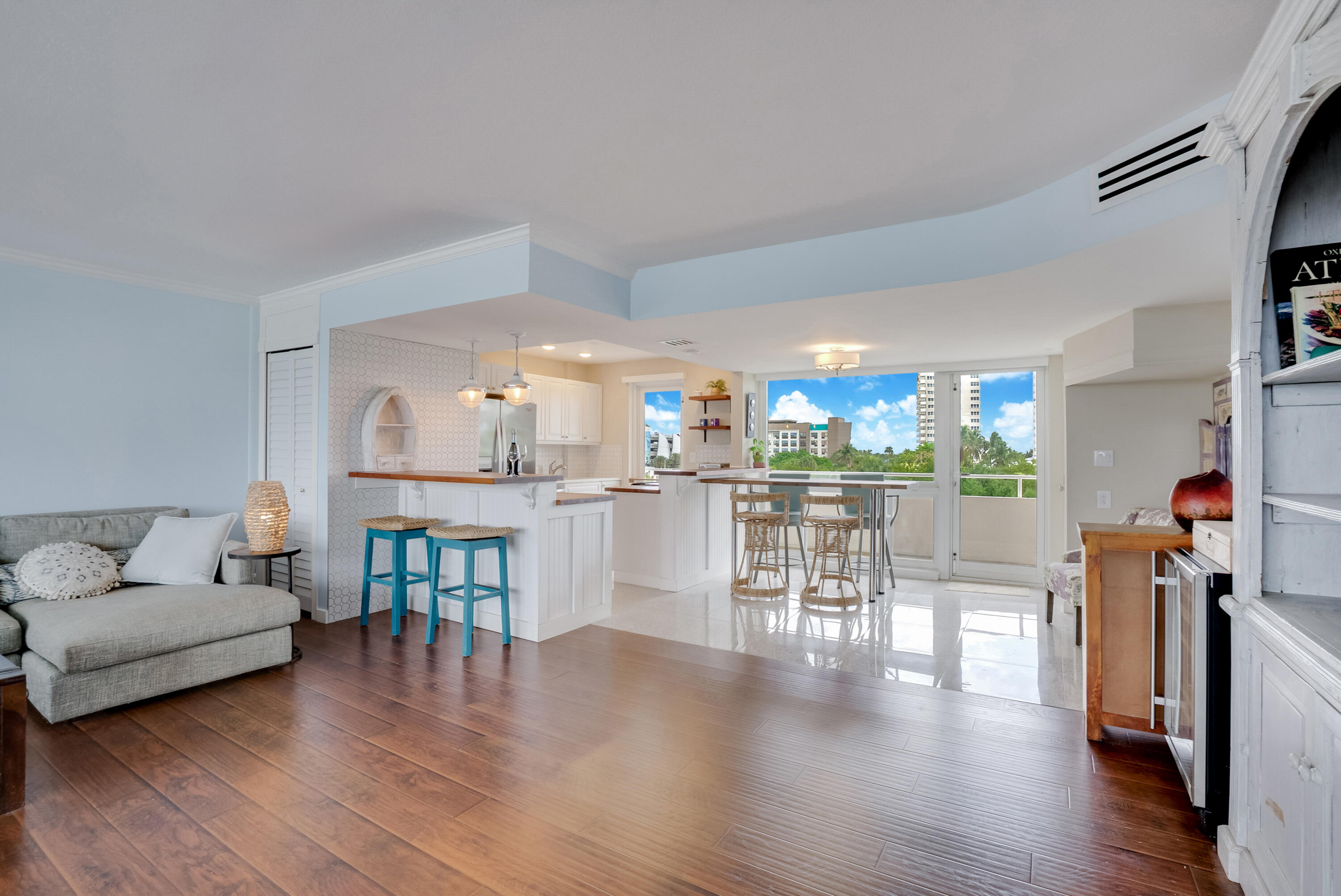 201 North Riverside Drive, Unit 402 Pompano Beach, FL 33062 - Photo 21 of 30 a living room with furniture and a wooden floor