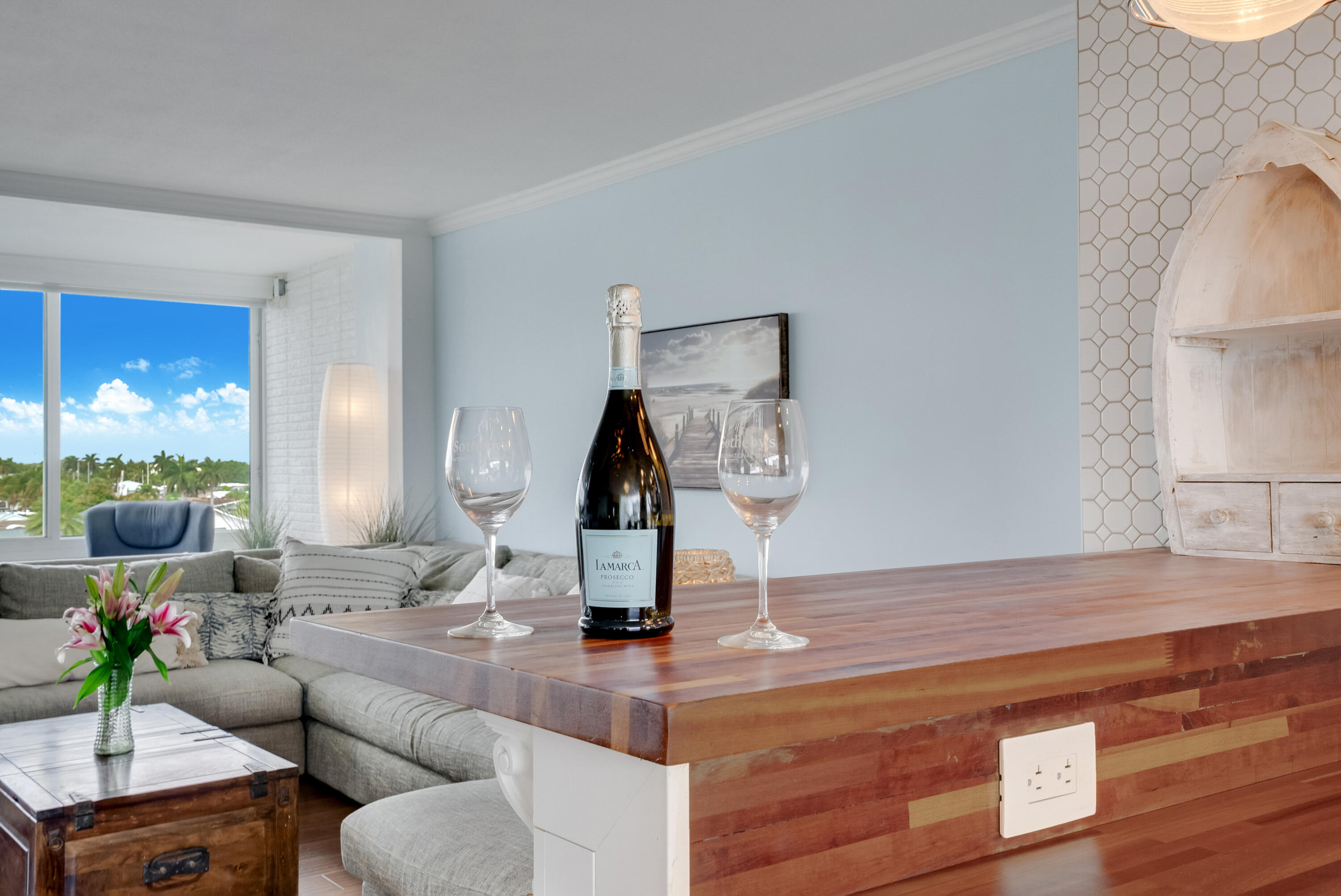 201 North Riverside Drive, Unit 402 Pompano Beach, FL 33062 - Photo 24 of 30 a living room with furniture and a clock