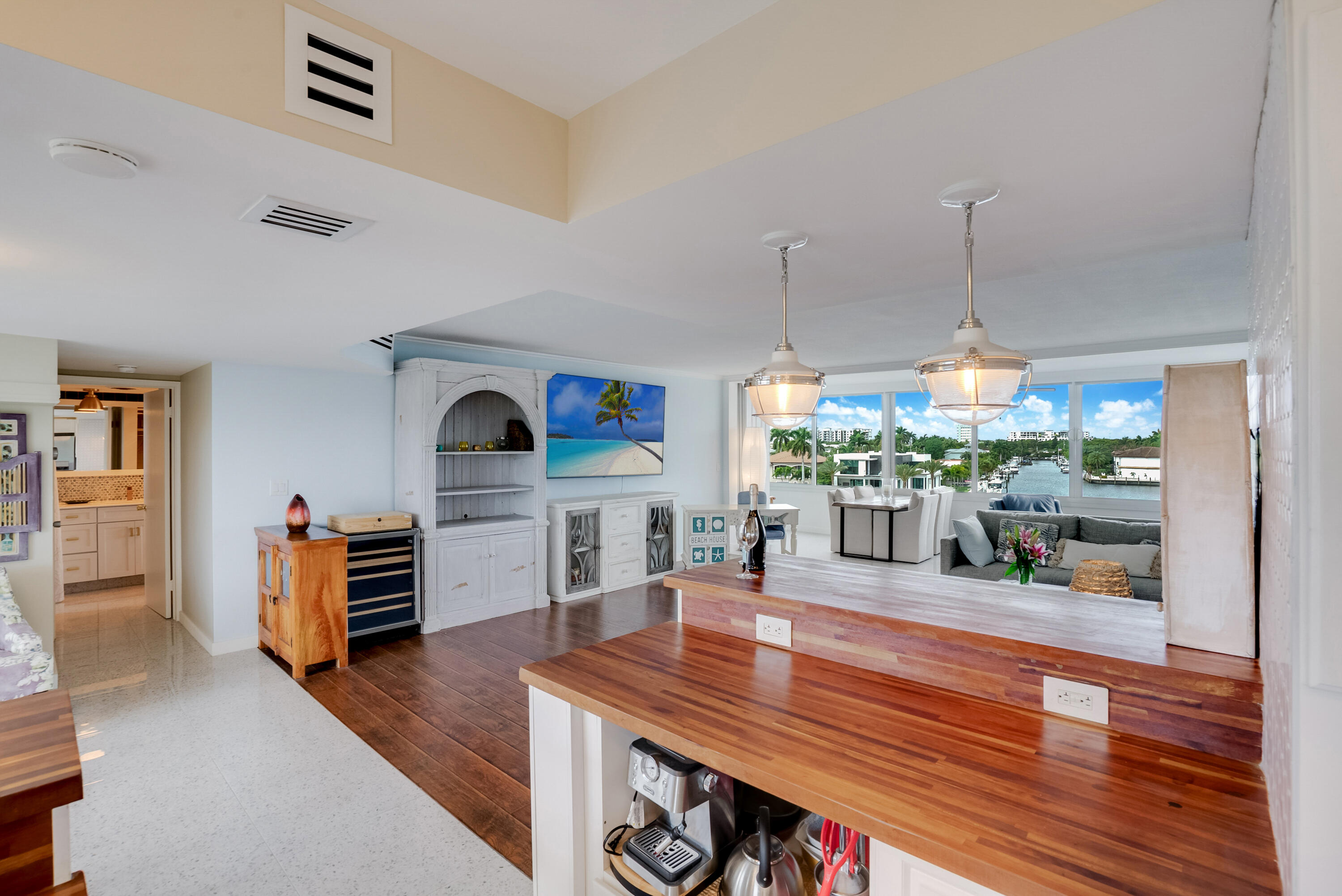 201 North Riverside Drive, Unit 402 Pompano Beach, FL 33062 - Photo 26 of 30 a dining room with furniture and wooden floor