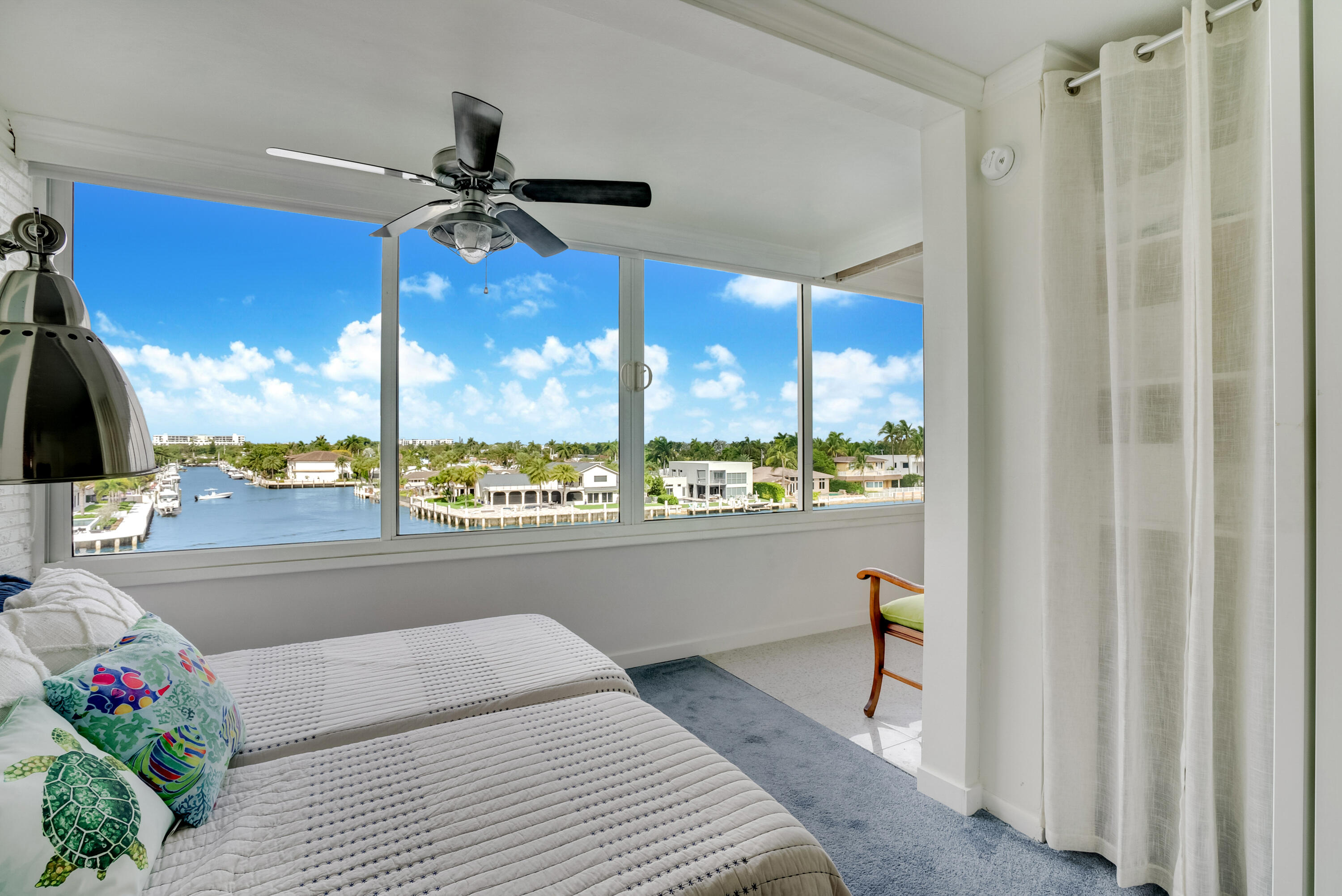 201 North Riverside Drive, Unit 402 Pompano Beach, FL 33062 - Photo 8 of 30 a living room with stainless steel appliances furniture a chandelier and a view of kitchen