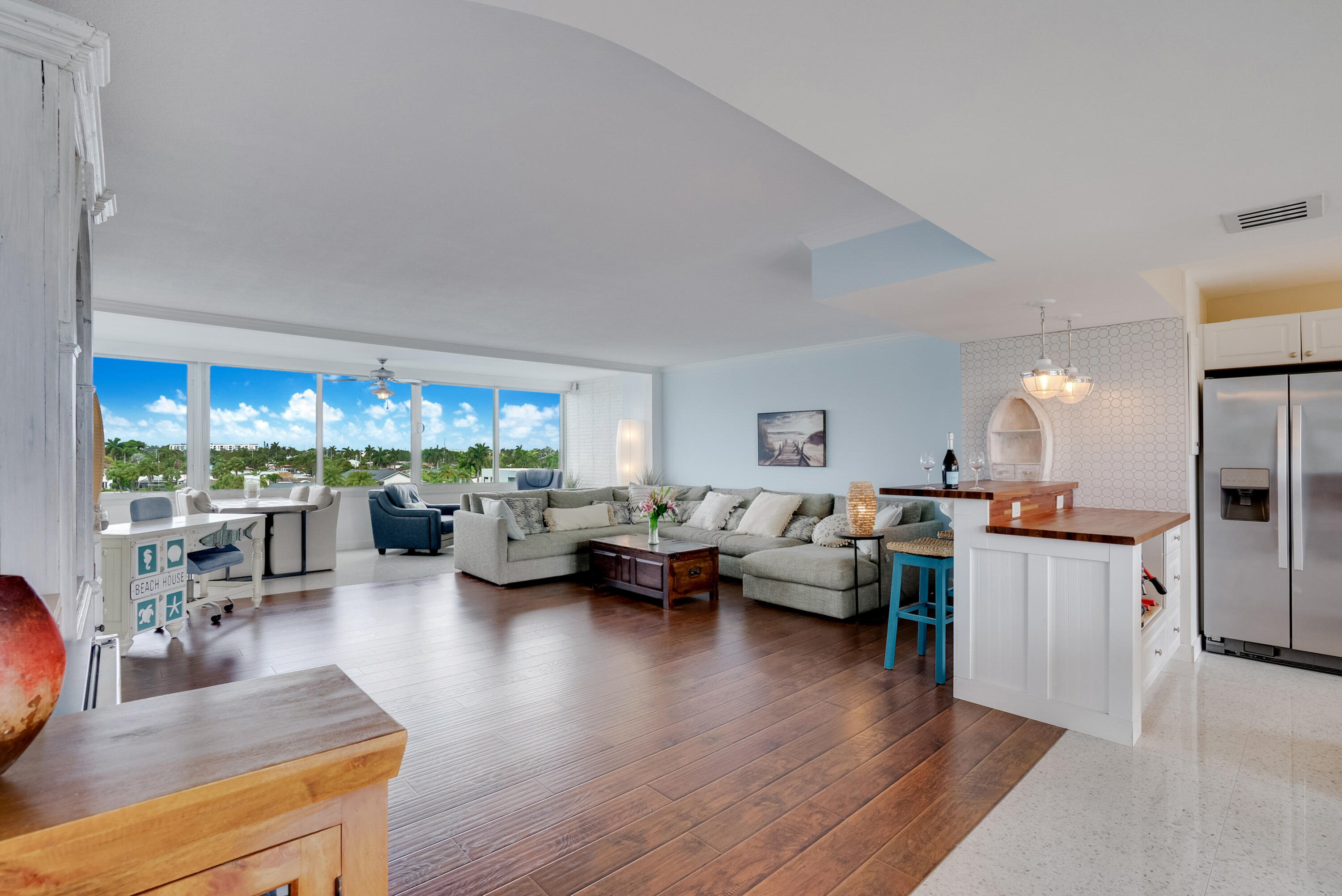 201 North Riverside Drive, Unit 402 Pompano Beach, FL 33062 - Photo 9 of 30 a living room with furniture and a wooden floor