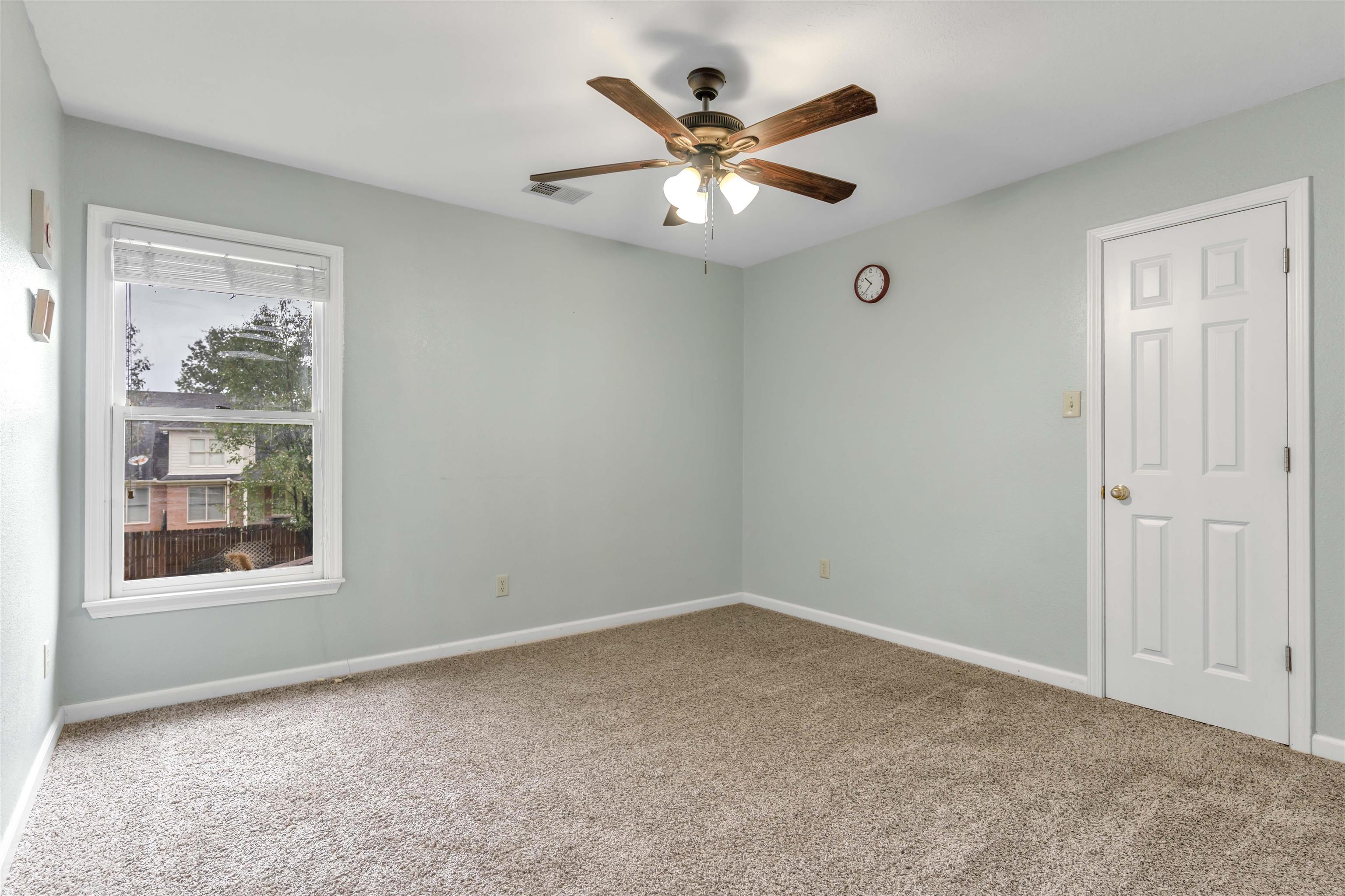 1335 Riding Brook Drive Collierville, TN 38017 - Photo 18 of 32 an empty room with window and ceiling fan