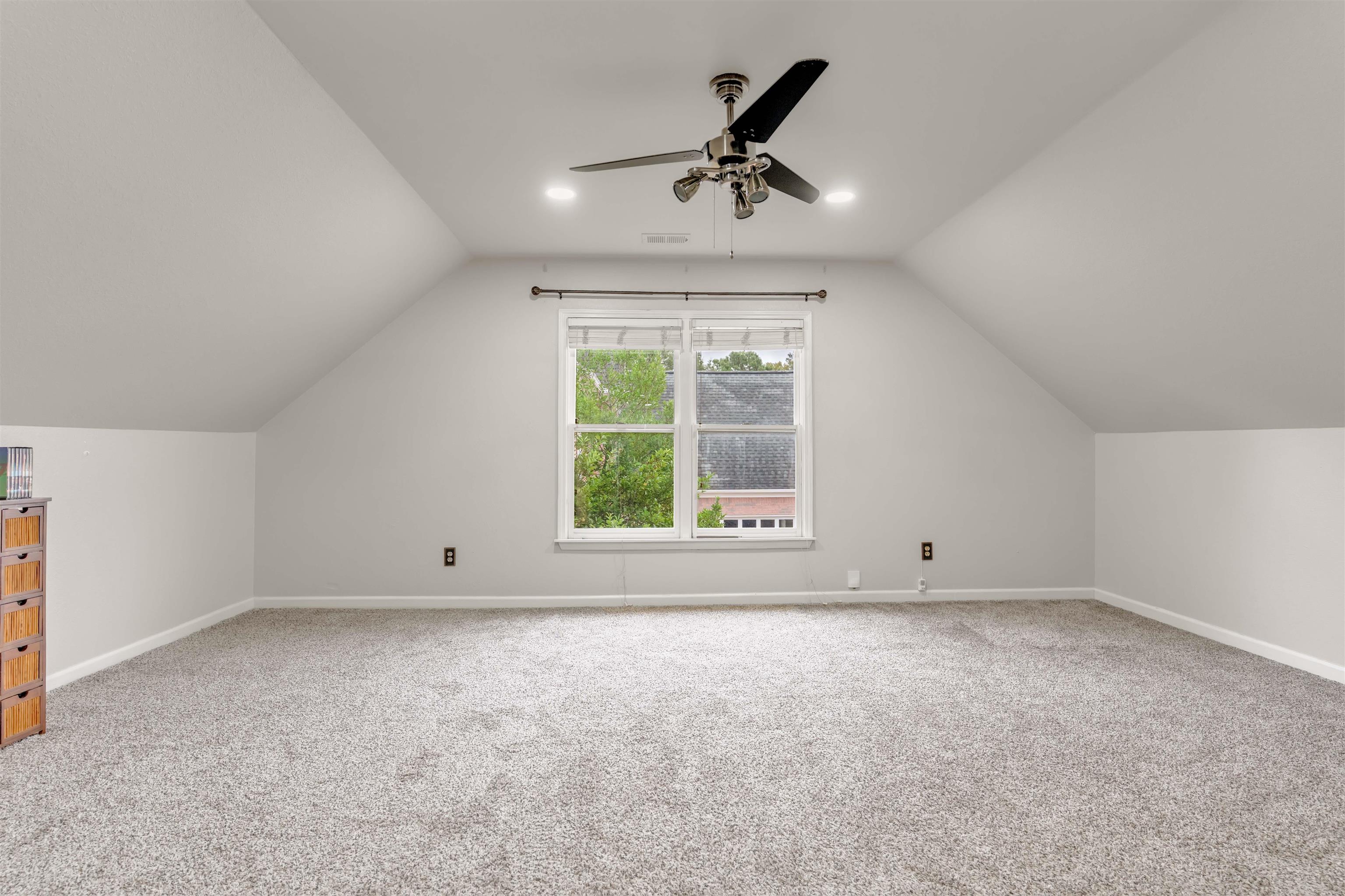 1335 Riding Brook Drive Collierville, TN 38017 - Photo 19 of 32 Additional living space with vaulted ceiling, light carpet, a ceiling fan, and recessed lighting