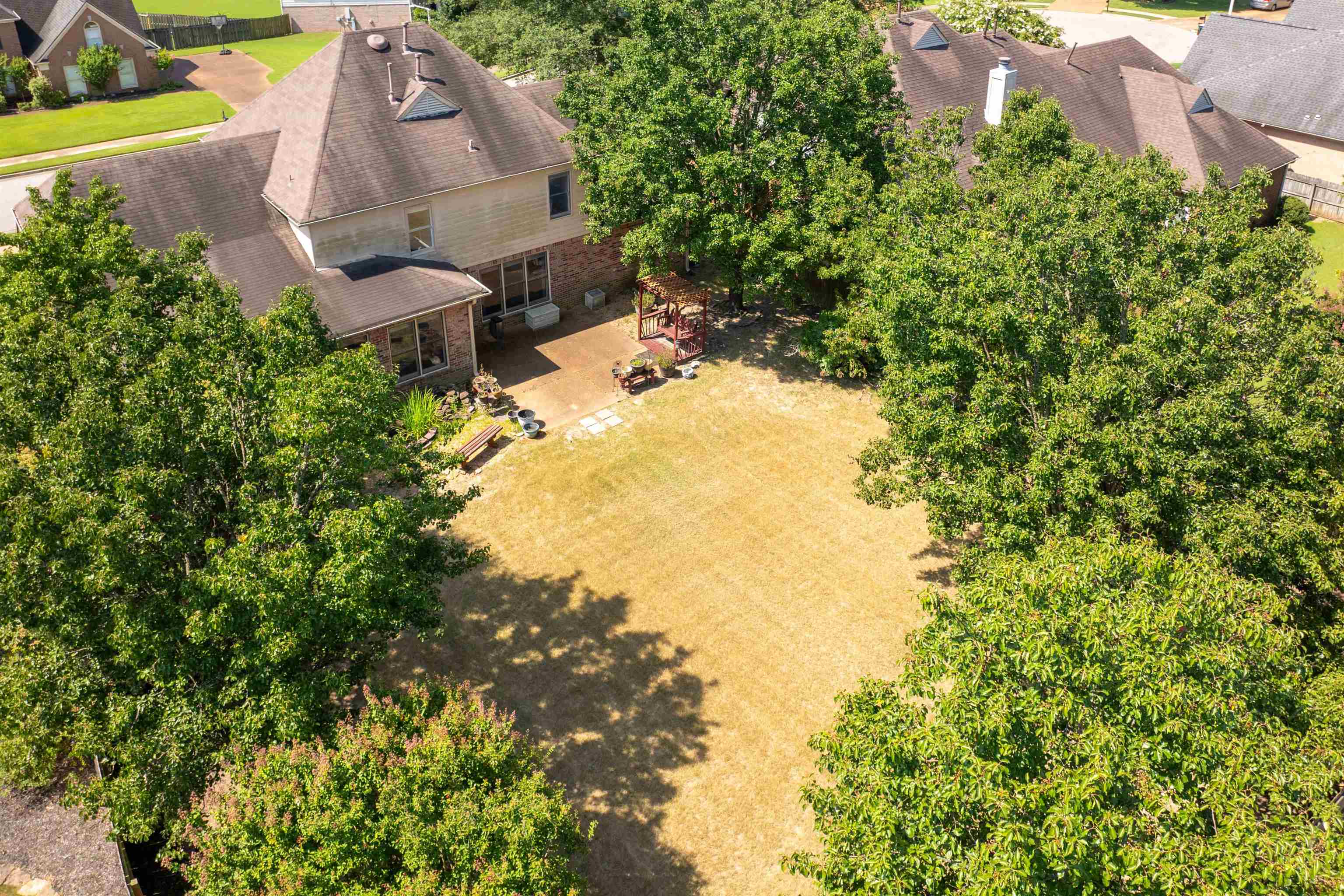 1335 Riding Brook Drive Collierville, TN 38017 - Photo 28 of 32 an aerial view of a house with swimming pool and garden