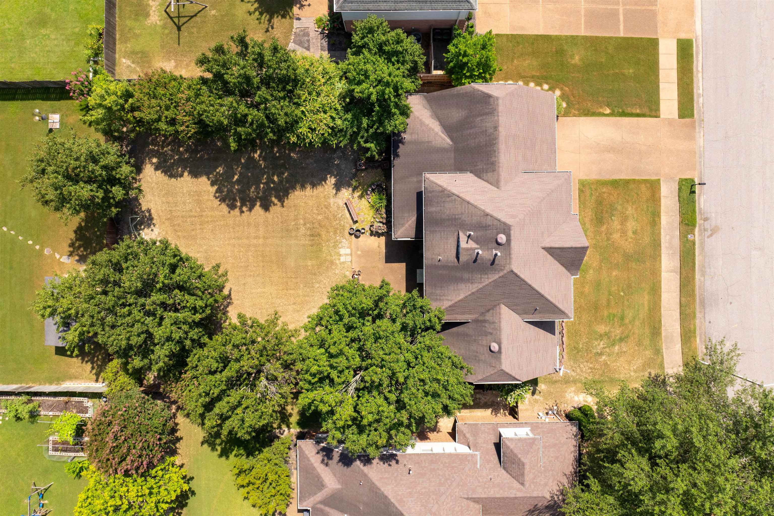 1335 Riding Brook Drive Collierville, TN 38017 - Photo 31 of 32 an aerial view of a house with a yard basket ball court and outdoor seating