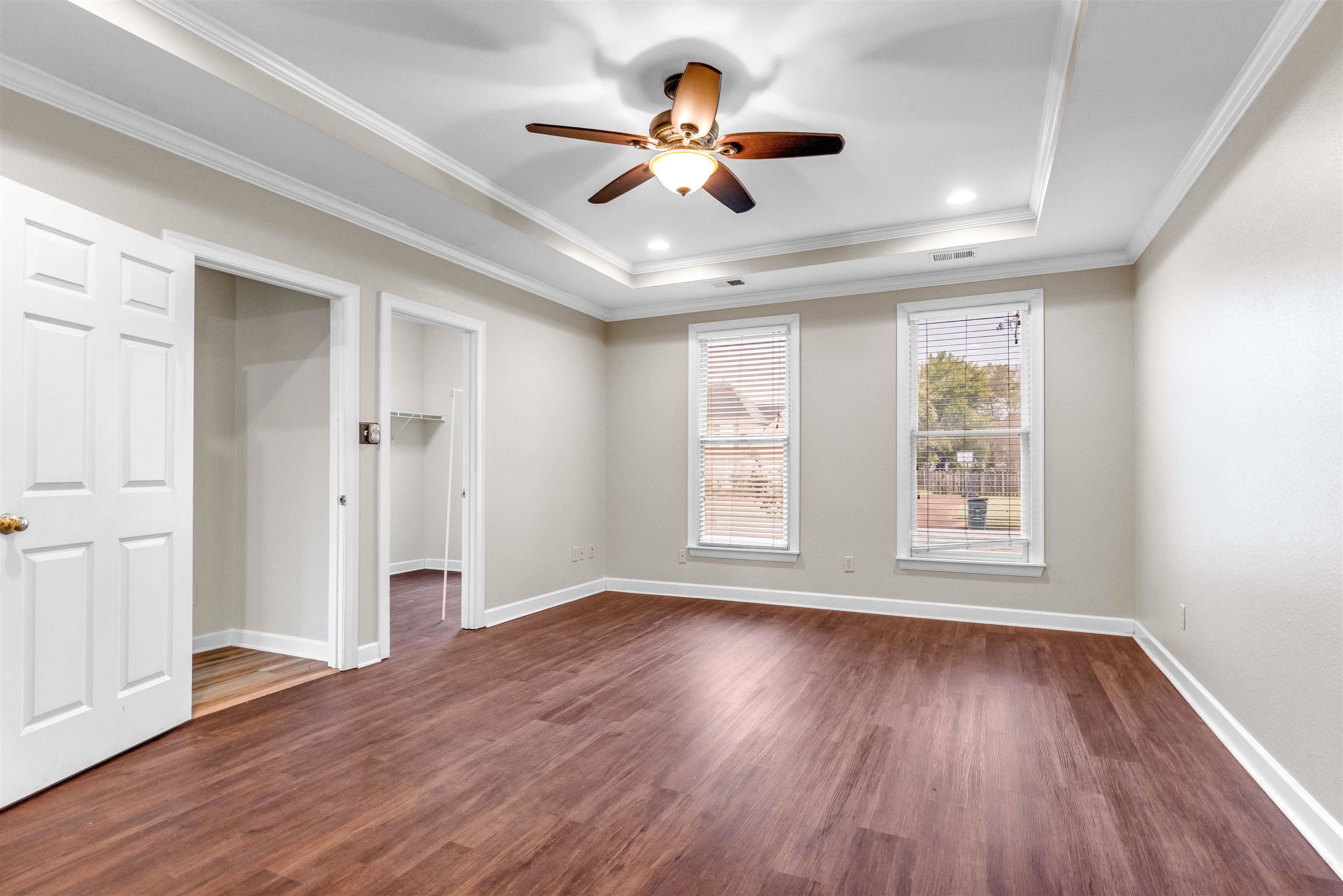 1335 Riding Brook Drive Collierville, TN 38017 - Photo 9 of 32 a view of an empty room with wooden floor and a window