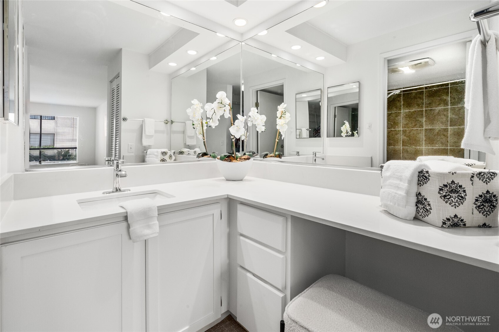 410 West Roy Street, Unit E101 Seattle, WA 98119 - Photo 20 of 33 a spacious bathroom with a sink double vanity and a mirror