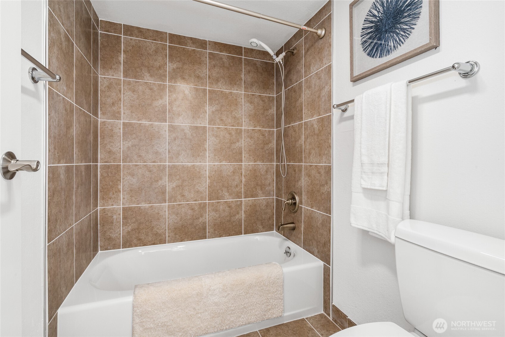 410 West Roy Street, Unit E101 Seattle, WA 98119 - Photo 23 of 33 a bathroom with a bathtub and a shower