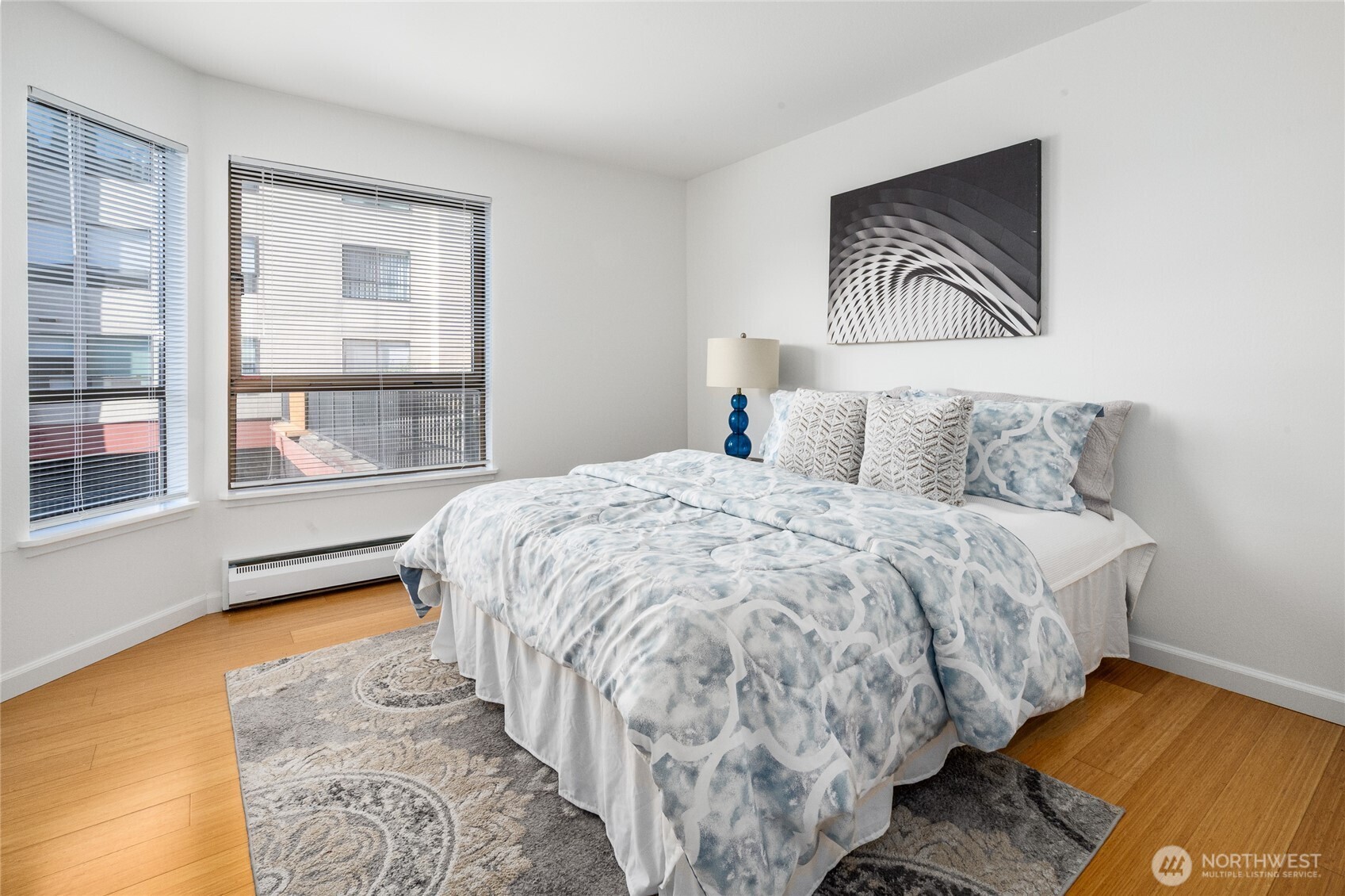 410 West Roy Street, Unit E101 Seattle, WA 98119 - Photo 24 of 33 a bedroom with a bed and a window