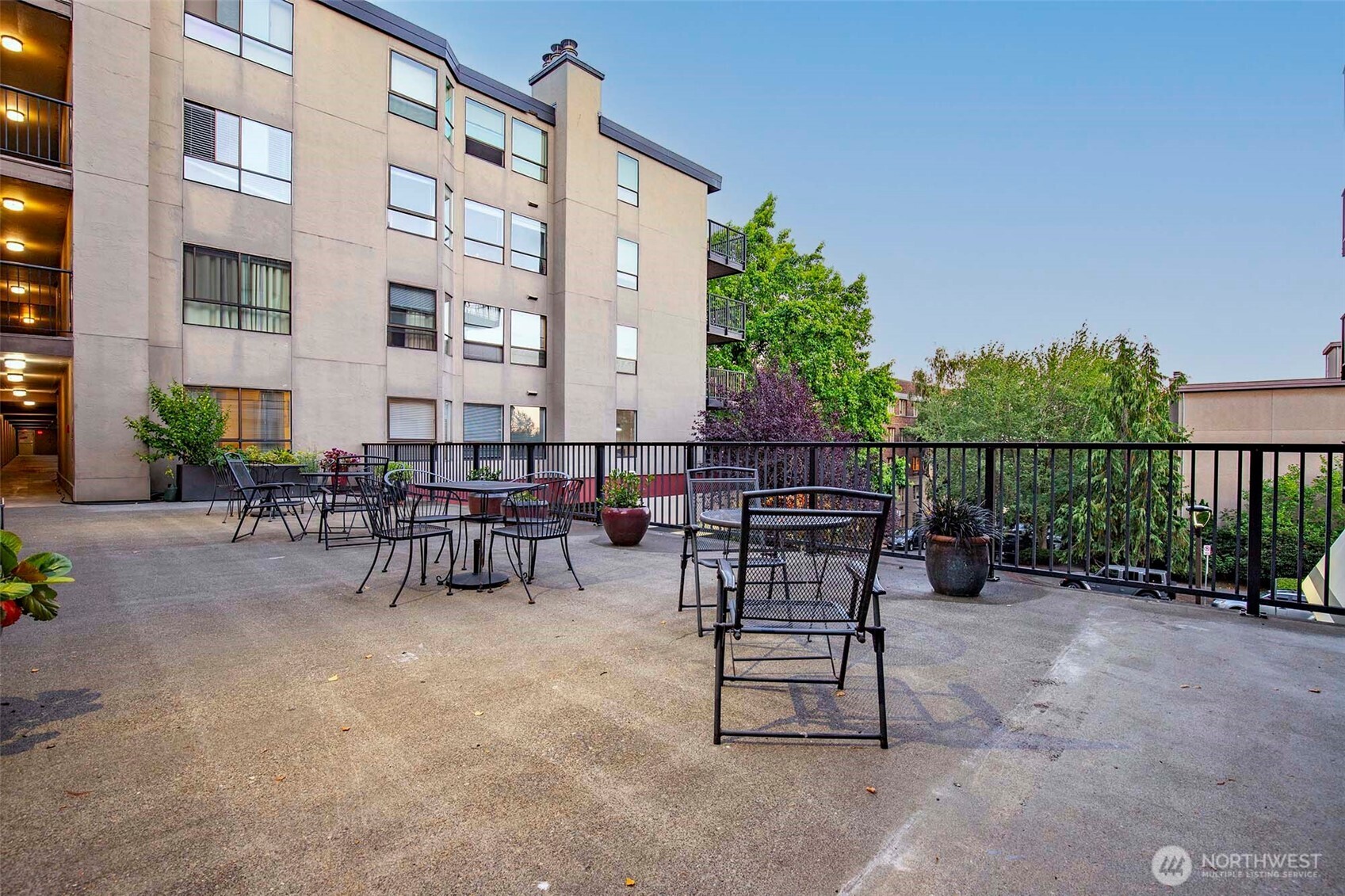 410 West Roy Street, Unit E101 Seattle, WA 98119 - Photo 31 of 33 a view of outdoor space with seating area and trees