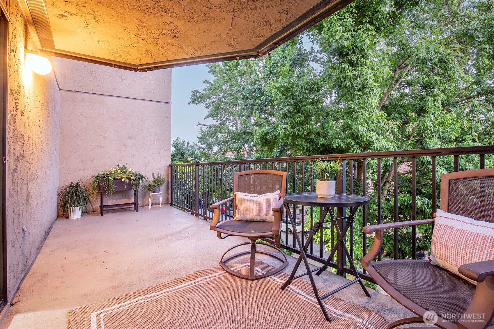 410 West Roy Street, Unit E101 Seattle, WA 98119 - Photo 7 of 33 a view of a chairs and table in the patio