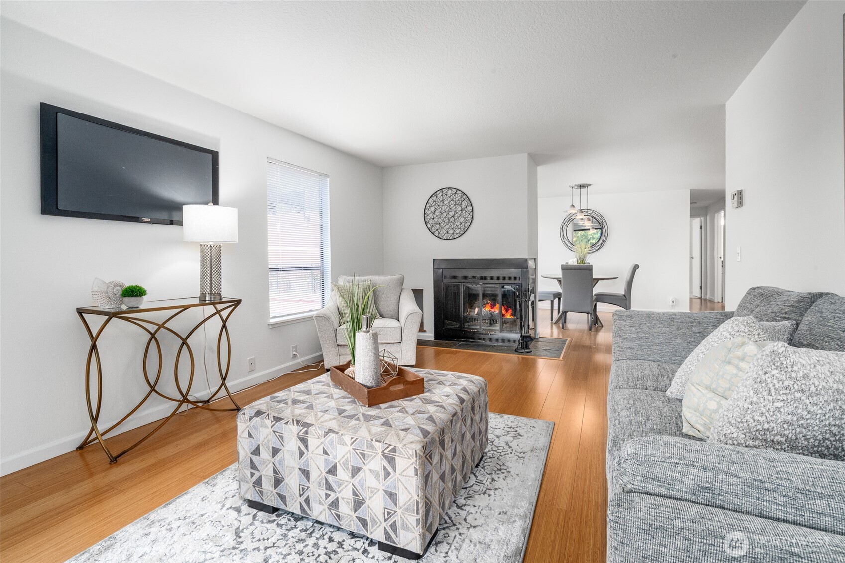 410 West Roy Street, Unit E101 Seattle, WA 98119 - Photo 9 of 33 a living room with furniture a flat screen tv and a fireplace