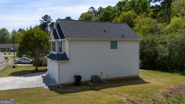 a view of house with yard