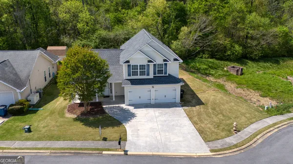 front view of a house with a yard
