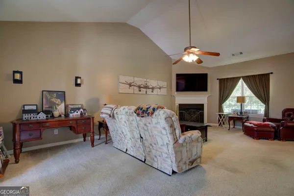 a bed room with furniture and a fireplace