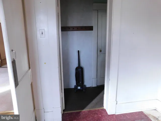 a kitchen with a sink cabinets and a window