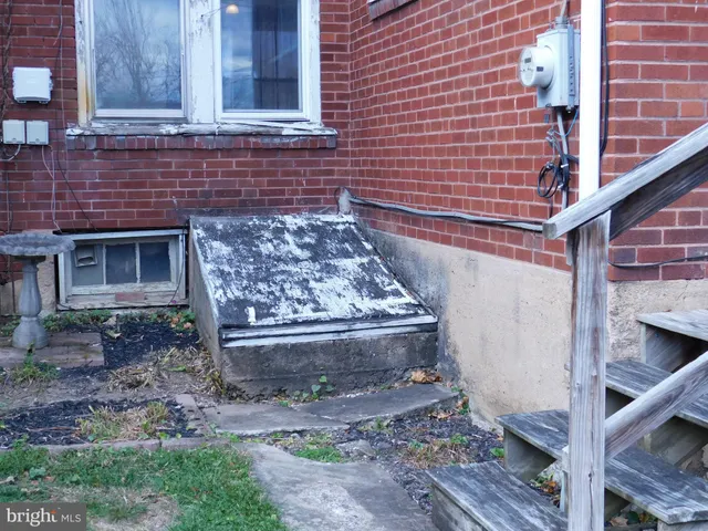 a front view of a house with a wooden fence