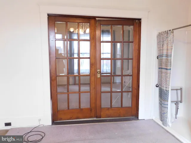 a view of front door with yard
